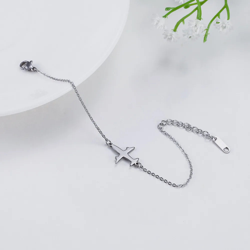Pulsera con colgante de avión  joyería de mano de acero inoxidable.