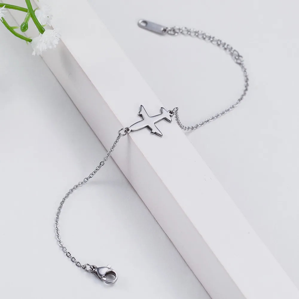 Pulsera con colgante de avión  joyería de mano de acero inoxidable.