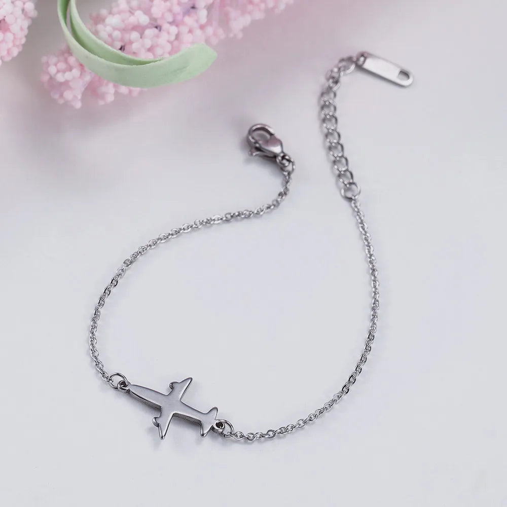 Pulsera con colgante de avión  joyería de mano de acero inoxidable.